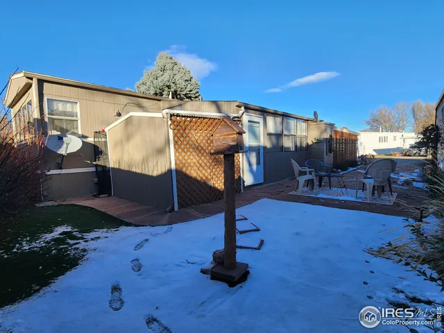 a bedroom with furniture and a chandelier
