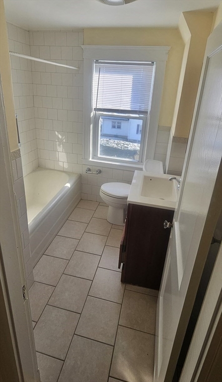 22 Endicott Street, Unit 3 Norwood, MA 02062 - Photo 17 of 22 a bathroom with a sink a toilet and shower