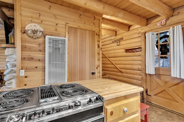 a kitchen with stainless steel appliances granite countertop a sink and cabinets