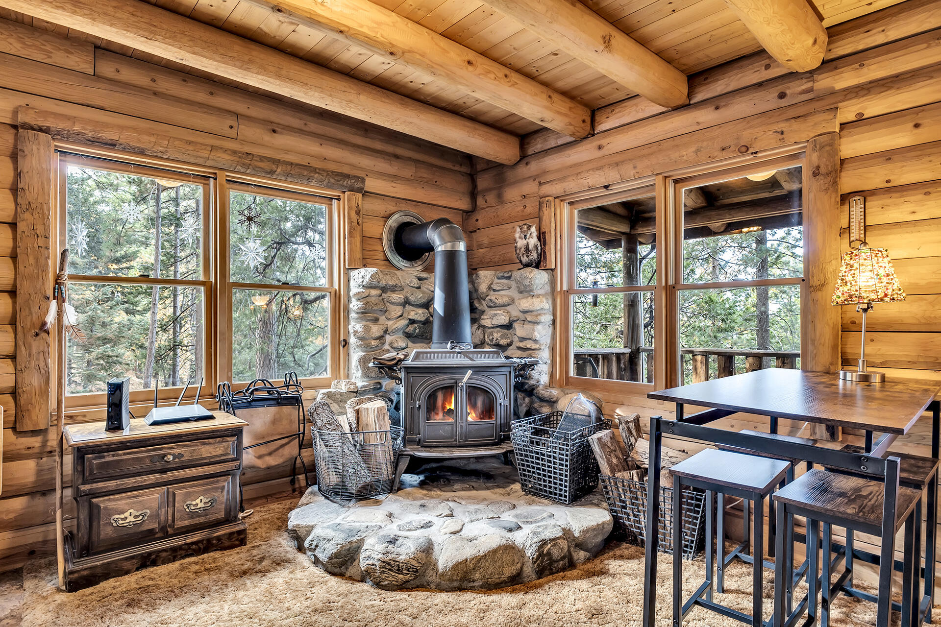 25121 Pine Cove Road Idyllwild, CA 92549 - Photo 18 of 65 a living room with furniture and floor to ceiling windows