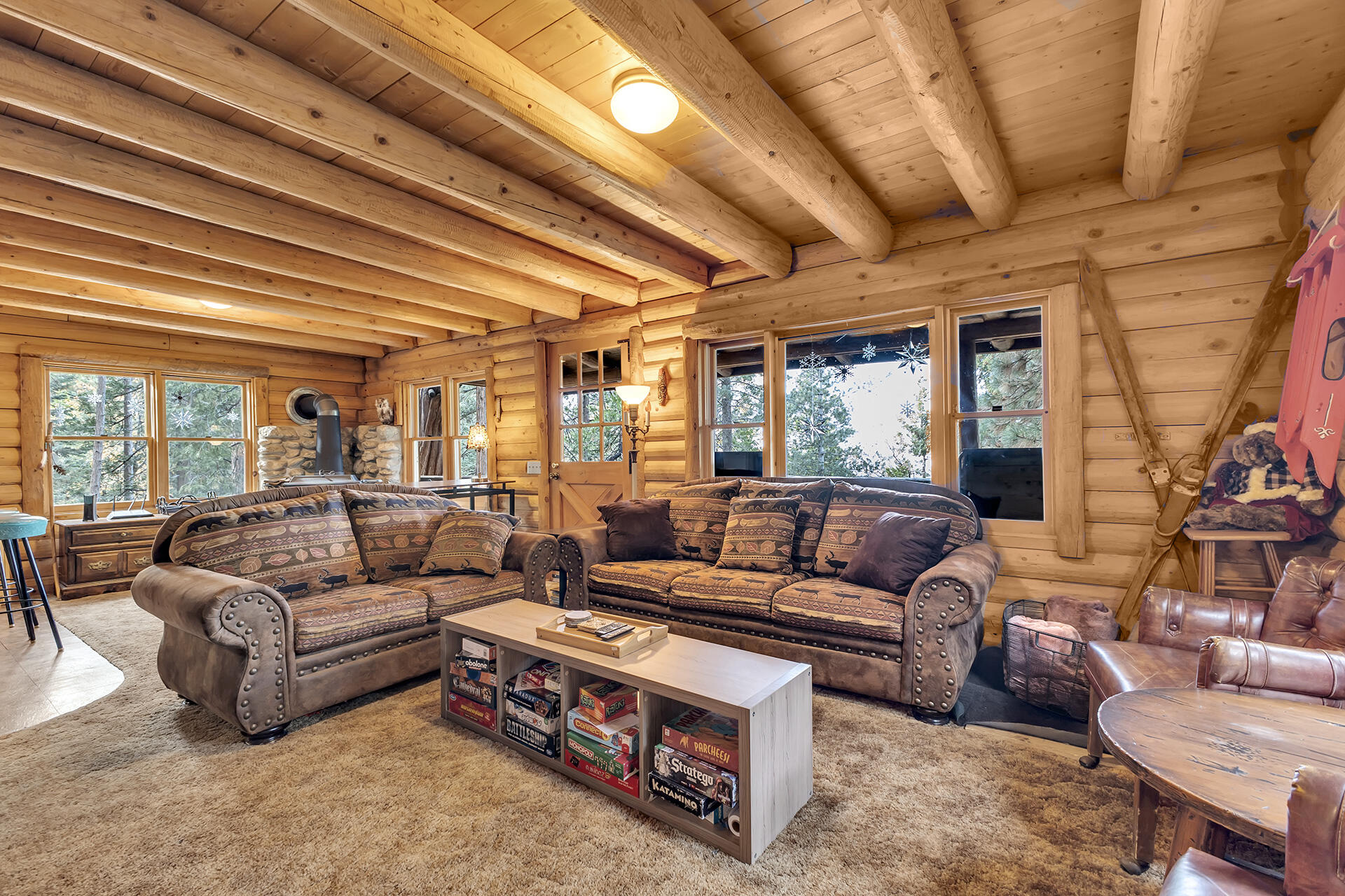 25121 Pine Cove Road Idyllwild, CA 92549 - Photo 22 of 65 a living room with furniture and a large window