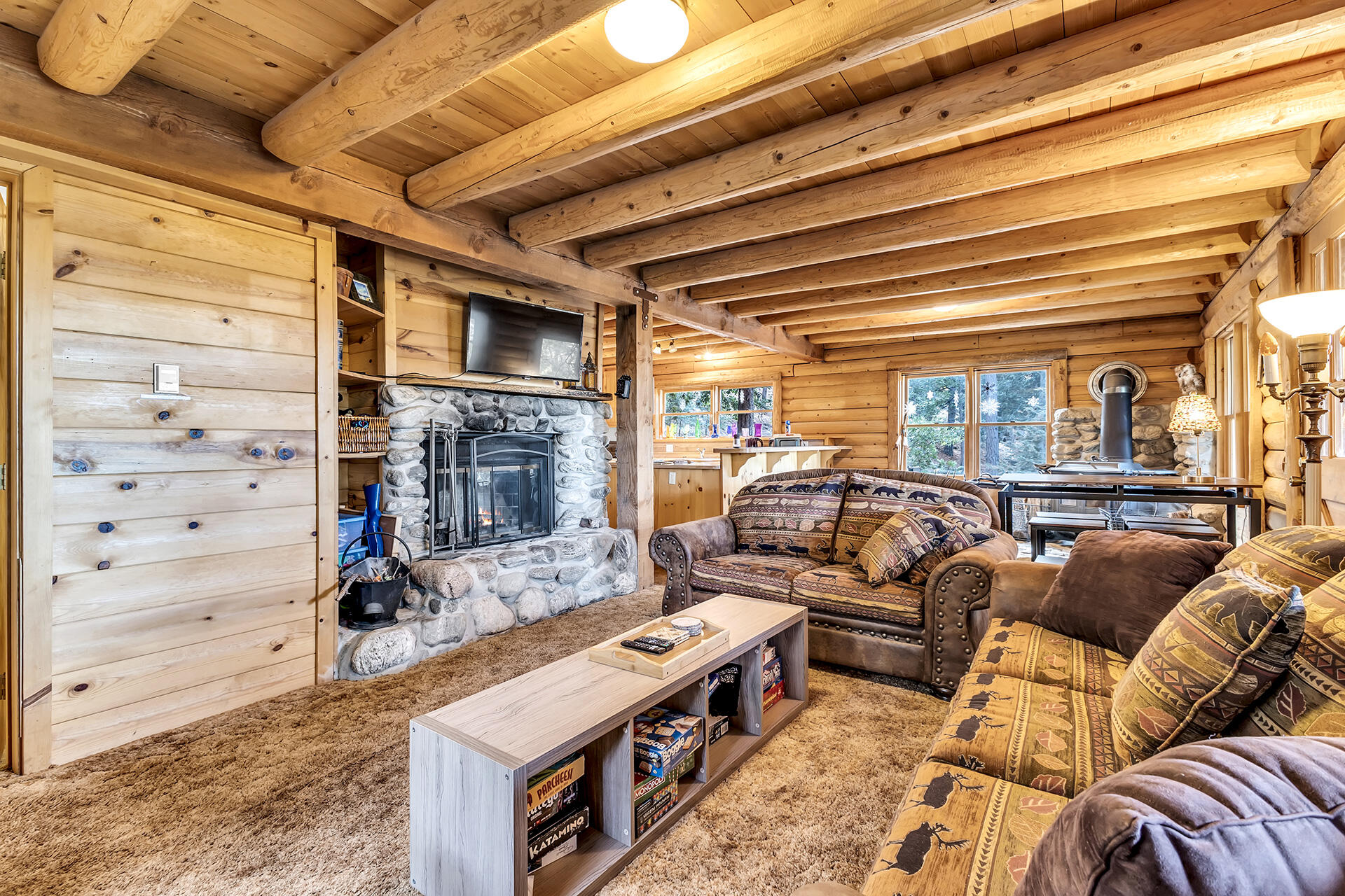 25121 Pine Cove Road Idyllwild, CA 92549 - Photo 23 of 65 a living room with furniture and a flat screen tv