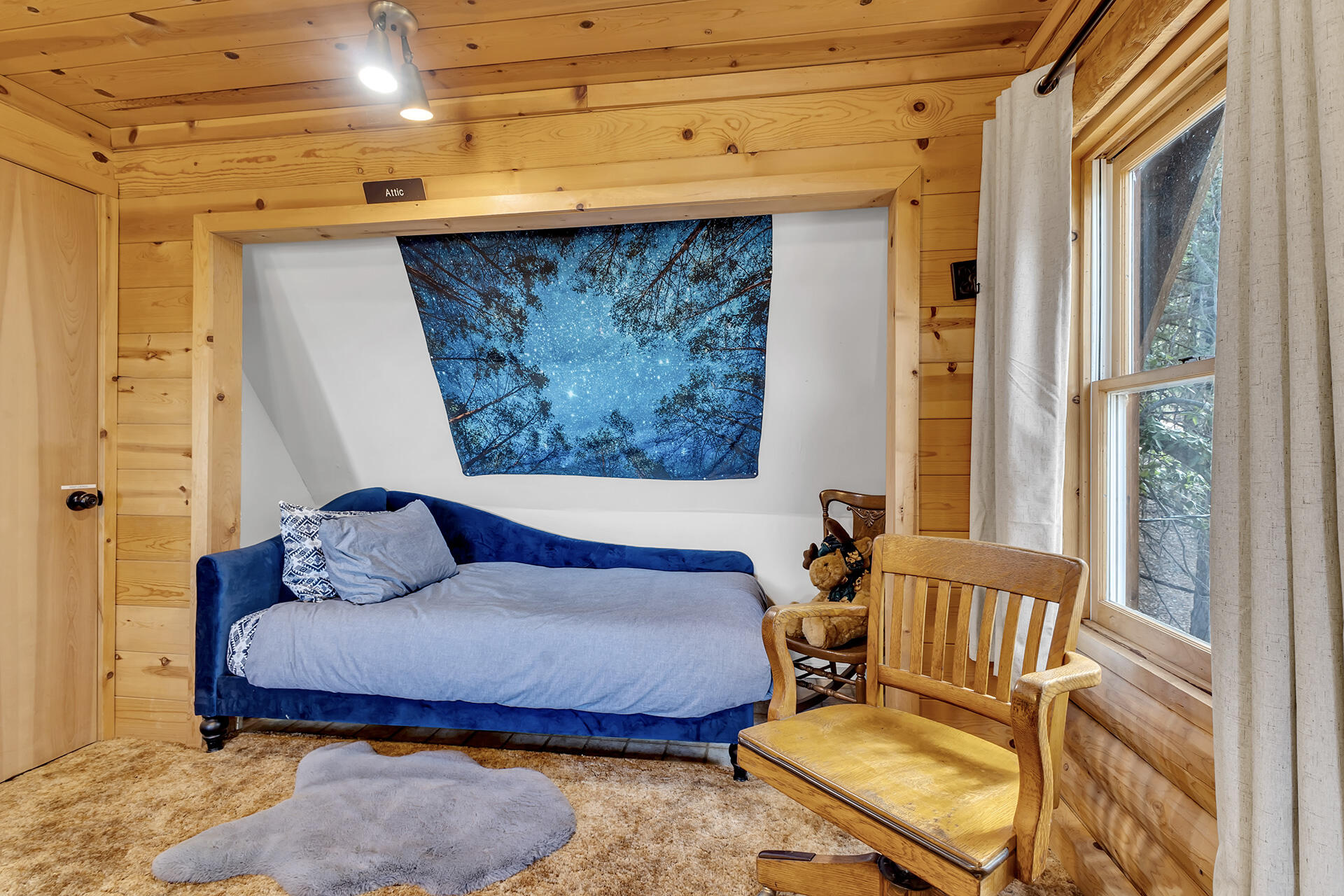 25121 Pine Cove Road Idyllwild, CA 92549 - Photo 36 of 65 a bedroom with a bed and wooden floor