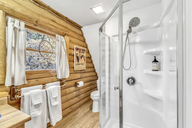 a bathroom with a sink toilet and mirror