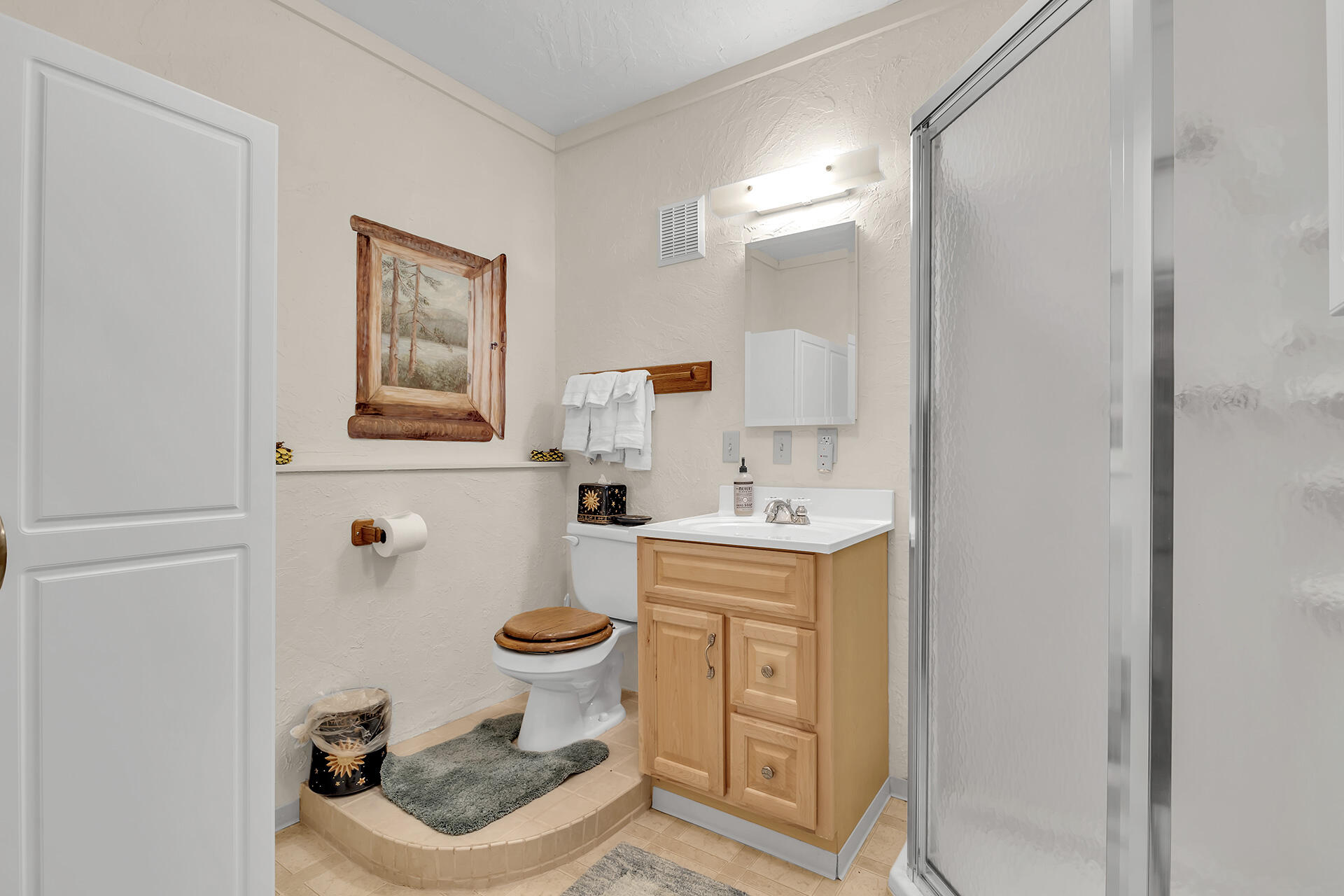 25121 Pine Cove Road Idyllwild, CA 92549 - Photo 56 of 65 a bathroom with a sink toilet and mirror