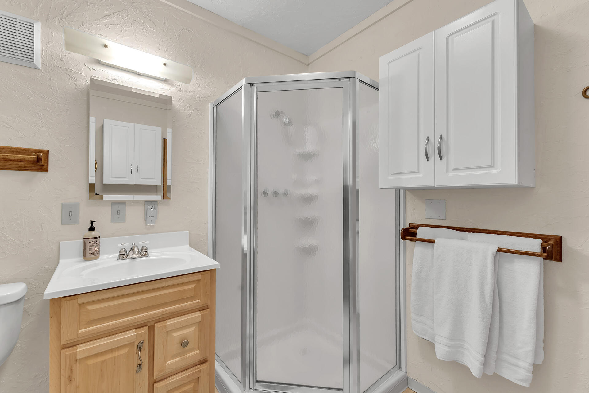 25121 Pine Cove Road Idyllwild, CA 92549 - Photo 57 of 65 a bathroom with a sink vanity and a mirror