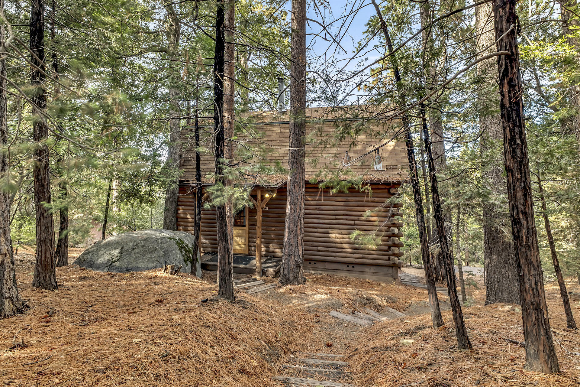 25121 Pine Cove Road Idyllwild, CA 92549 - Photo 6 of 65 a view of a house with large trees