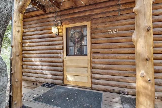 a kitchen with a stove a sink and a wooden cabinets
