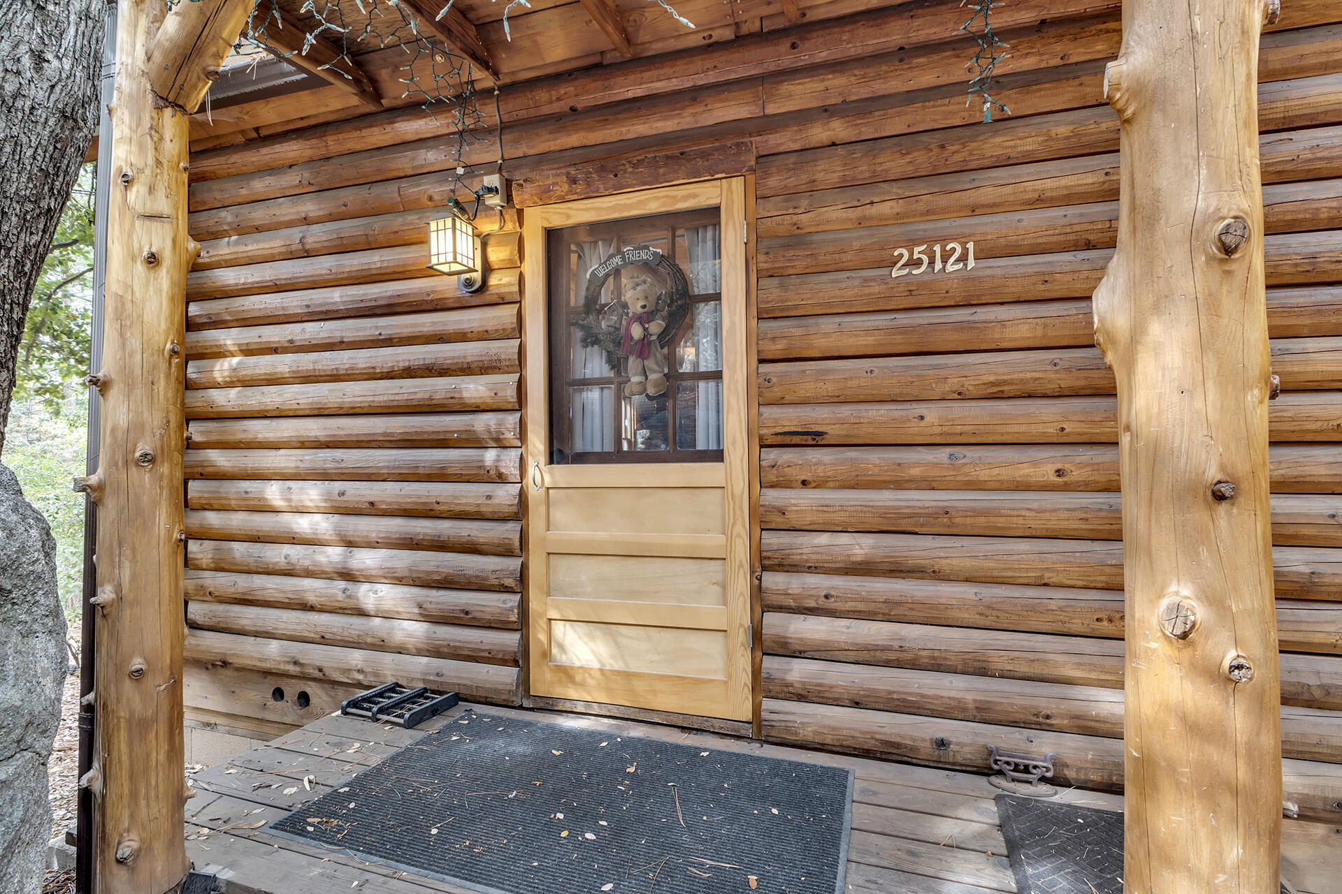 25121 Pine Cove Road Idyllwild, CA 92549 - Photo 9 of 65 a view of a wooden door and a window