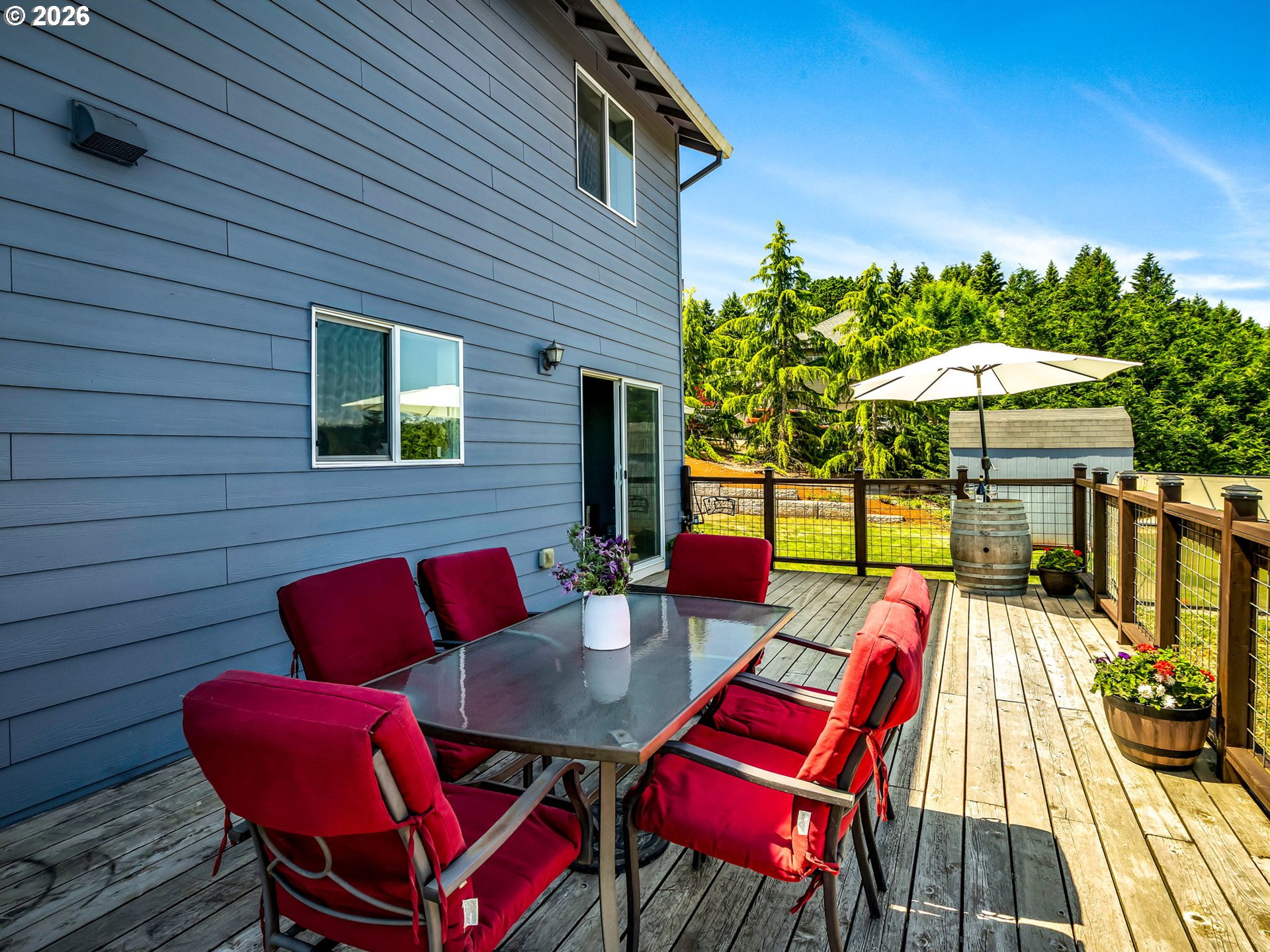 19775 Northeast Trunk Road Dundee, OR 97115 - Photo 14 of 48 a patio with a table and chairs