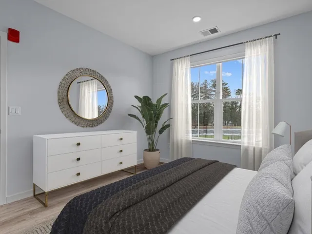 a bathroom with a shower and a mirror