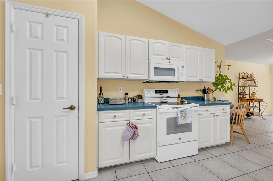 1641 Laconia Street Sebastian, FL 32958 - Photo 16 of 32 a kitchen with cabinets appliances and a window