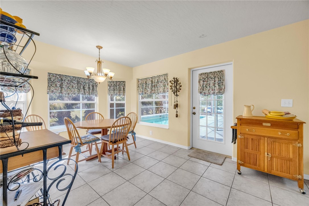1641 Laconia Street Sebastian, FL 32958 - Photo 18 of 32 a view of a dining room with furniture window and outside view