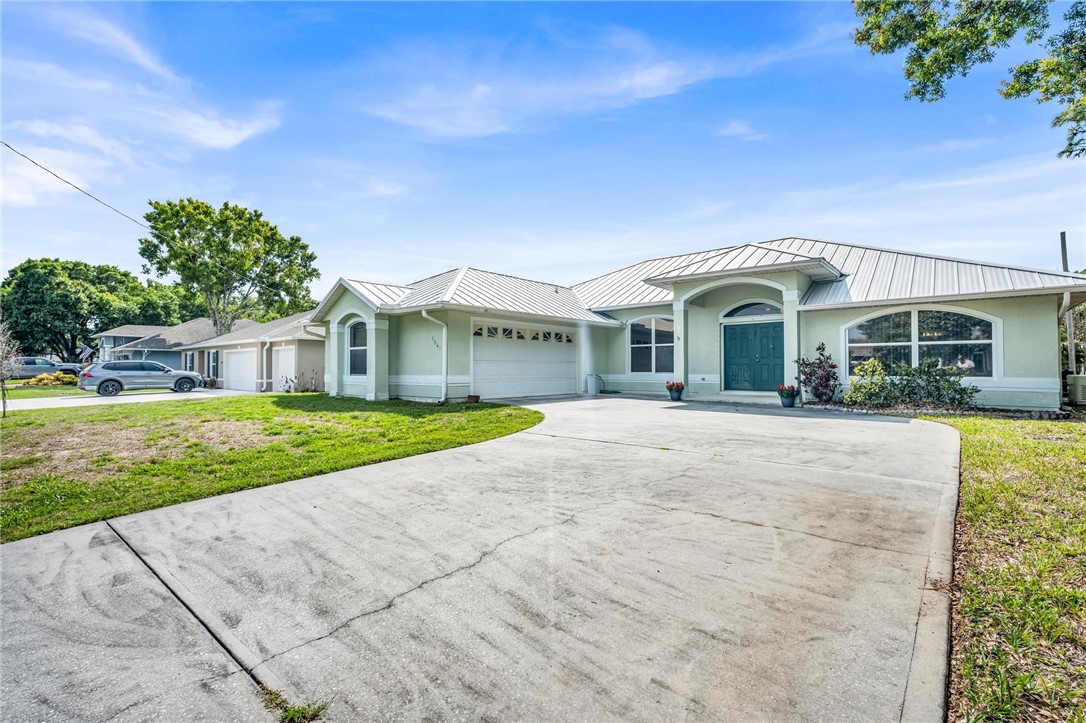 1641 Laconia Street Sebastian, FL 32958 - Photo 2 of 32 a front view of a house with a yard
