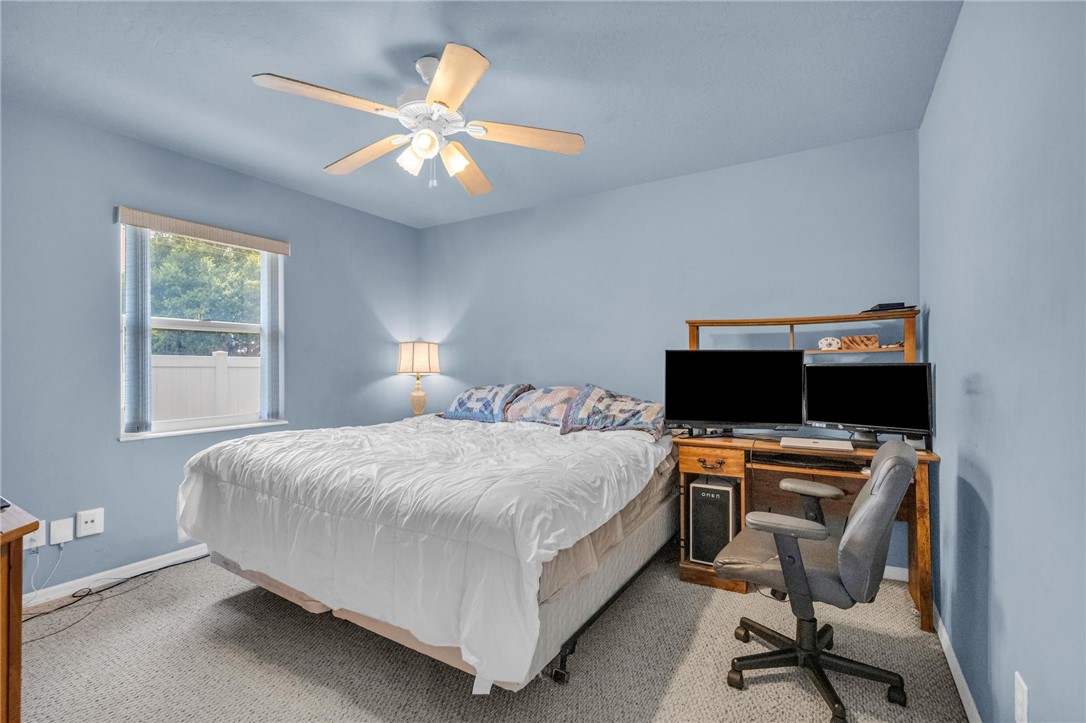 1641 Laconia Street Sebastian, FL 32958 - Photo 21 of 32 a bedroom with a bed and a desk