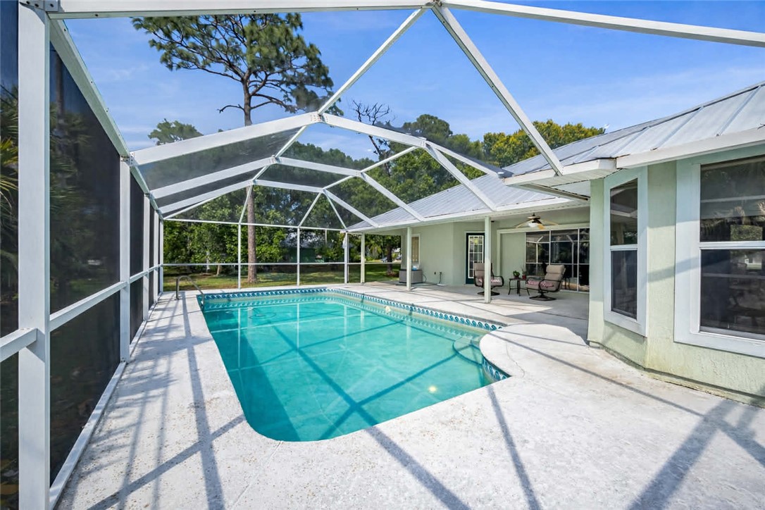 1641 Laconia Street Sebastian, FL 32958 - Photo 28 of 32 a view of a house with a swimming pool