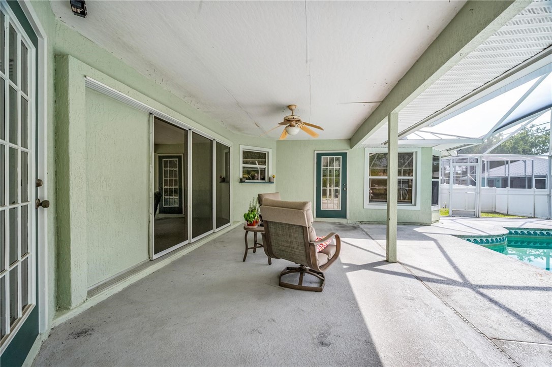 1641 Laconia Street Sebastian, FL 32958 - Photo 29 of 32 a building outdoor space with patio furniture and potted plants