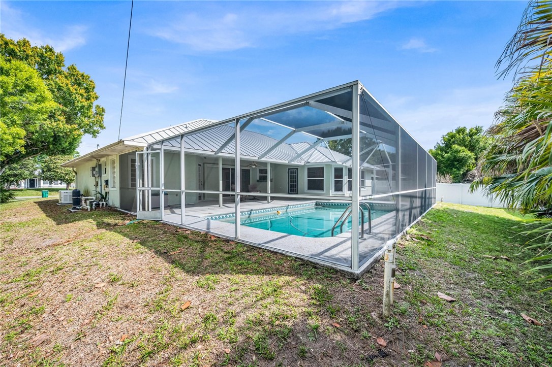 1641 Laconia Street Sebastian, FL 32958 - Photo 31 of 32 a view of a house with backyard and sitting area