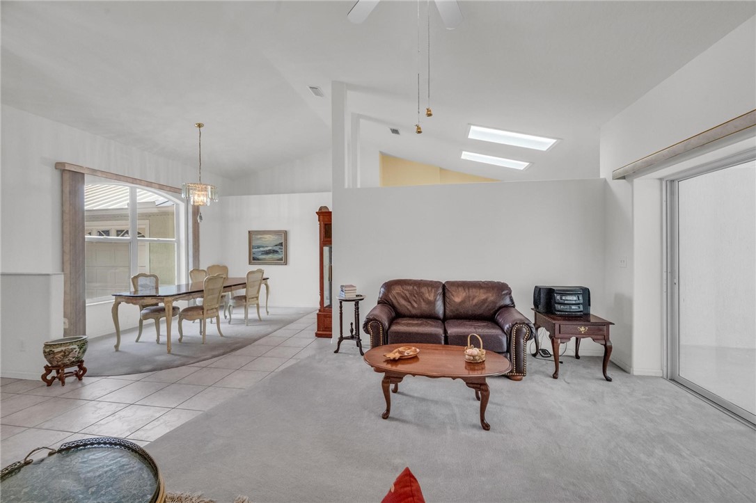 1641 Laconia Street Sebastian, FL 32958 - Photo 5 of 32 a living room with furniture and a chandelier