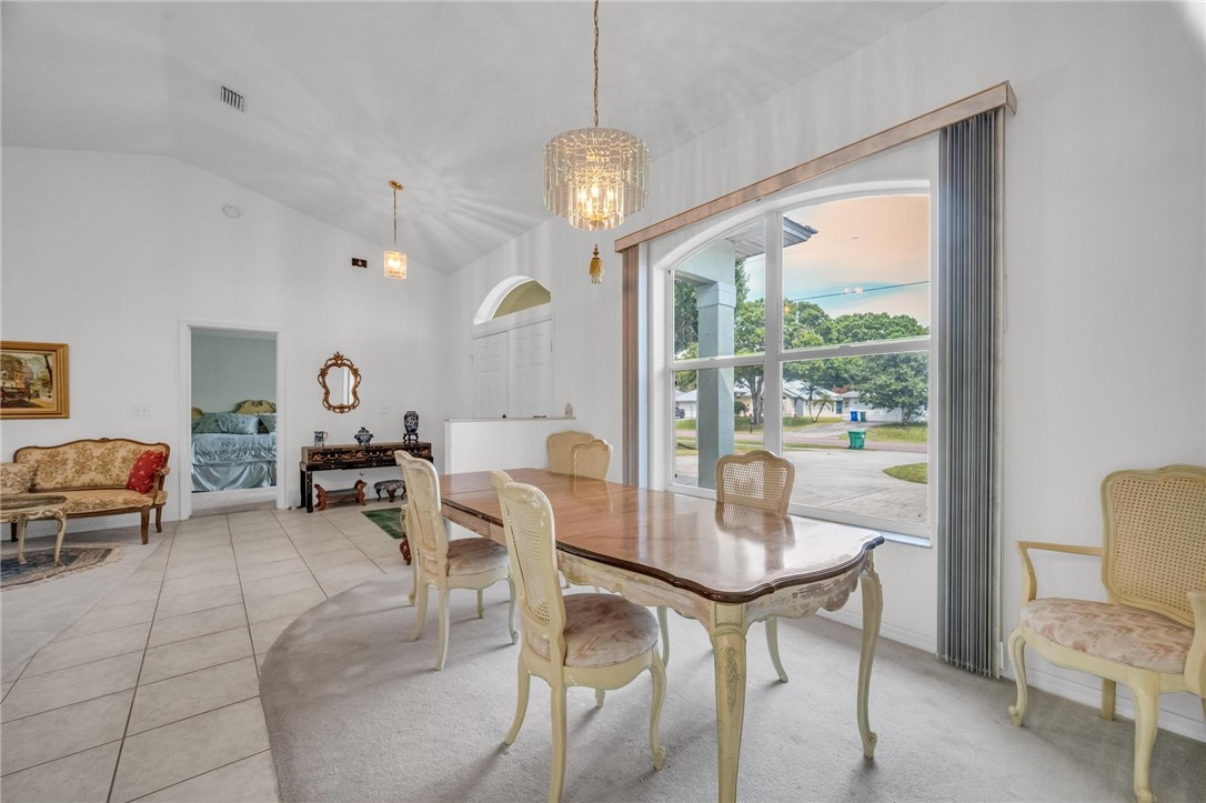 1641 Laconia Street Sebastian, FL 32958 - Photo 6 of 32 a view of a dining room with furniture window and outside view