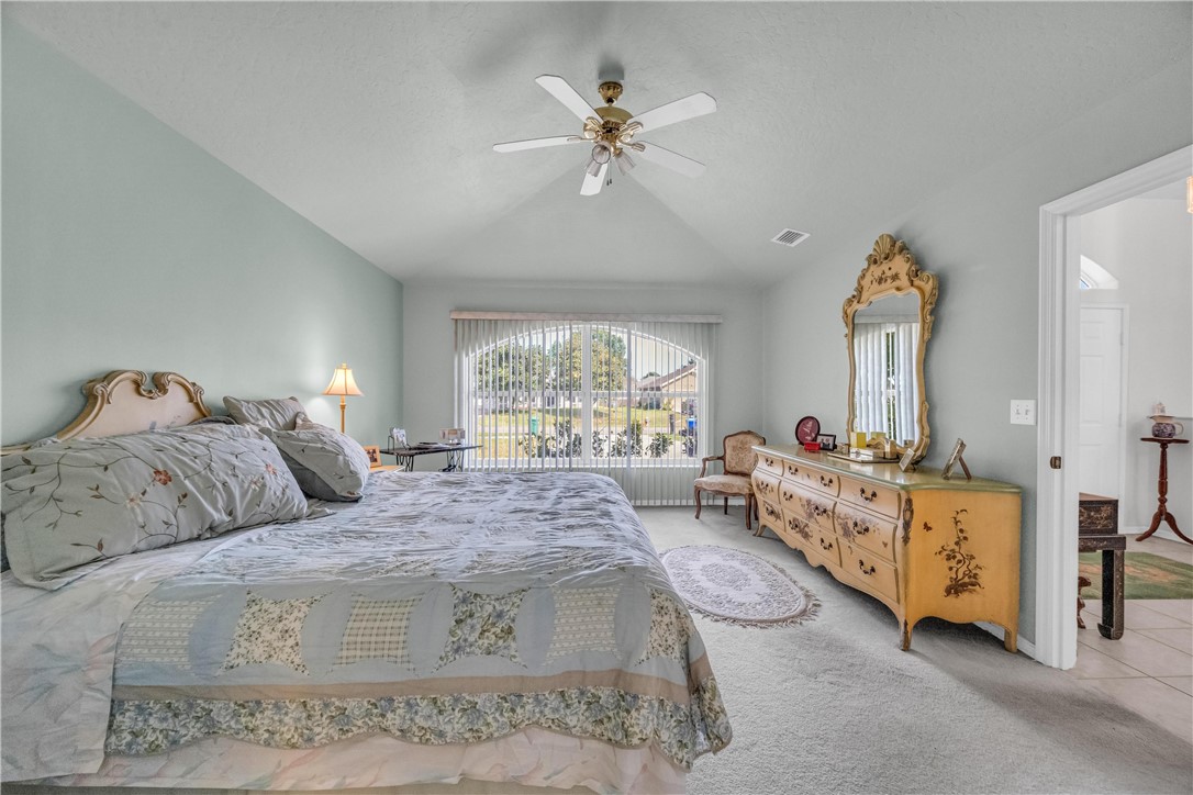 1641 Laconia Street Sebastian, FL 32958 - Photo 8 of 32 a bed room with a bed and a window