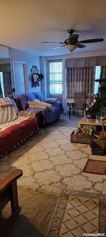 87-05 166th Street, Unit 4G Queens, NY 11432 - Photo 3 of 10 a bedroom with furniture and a window