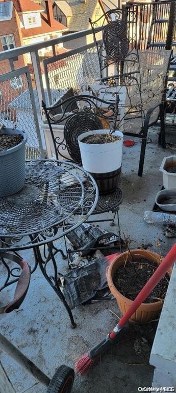 87-05 166th Street, Unit 4G Queens, NY 11432 - Photo 4 of 10 a view of a backyard with table and chairs