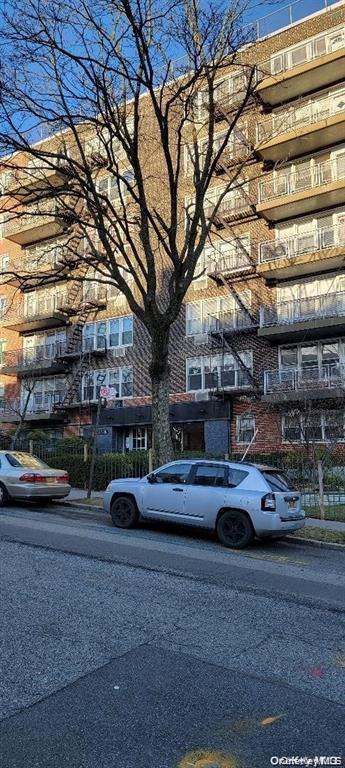 87-05 166th Street, Unit 4G Queens, NY 11432 - Photo 8 of 10 a cars parked on the side of street