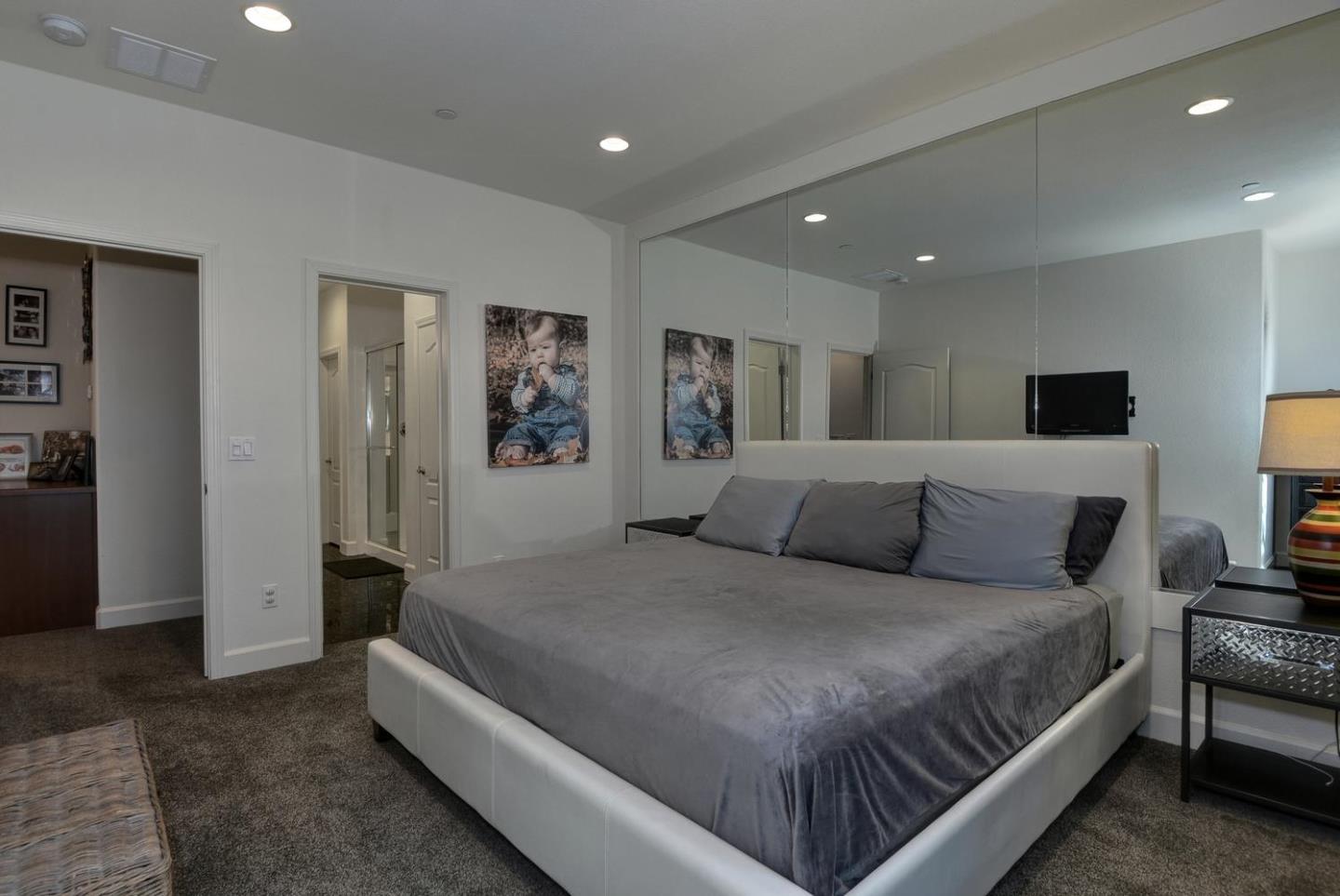 2870 Monroe Terrace San Jose, CA 95128 - Photo 11 of 28 a spacious bedroom with a bed and a couch