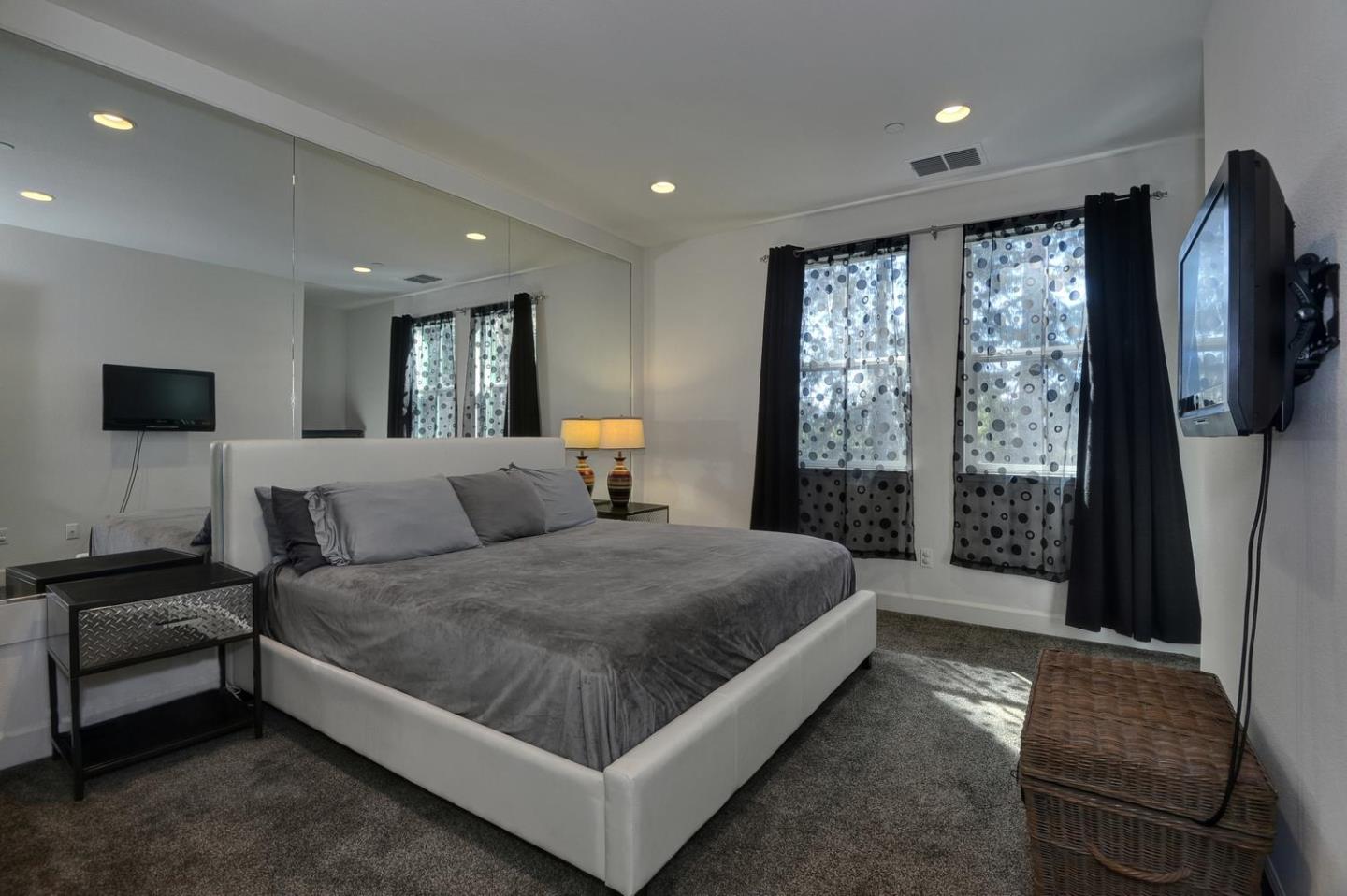 2870 Monroe Terrace San Jose, CA 95128 - Photo 12 of 28 a large bedroom with a bed and large window