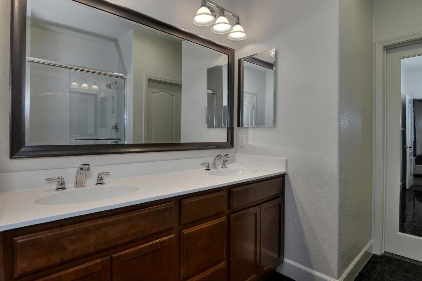 2870 Monroe Terrace San Jose, CA 95128 - Photo 13 of 28 a bathroom with a double vanity sink and a mirror