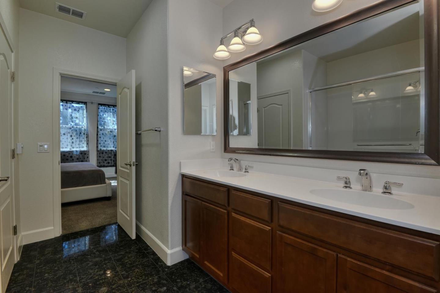 2870 Monroe Terrace San Jose, CA 95128 - Photo 14 of 28 a en suite bathroom with a double vanity sink and mirror