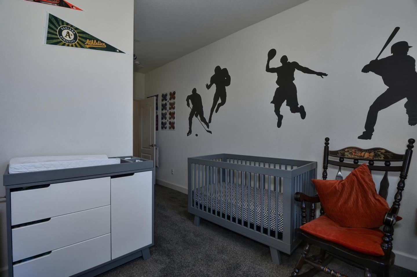 2870 Monroe Terrace San Jose, CA 95128 - Photo 19 of 28 a hallway with a baby crib and a dresser
