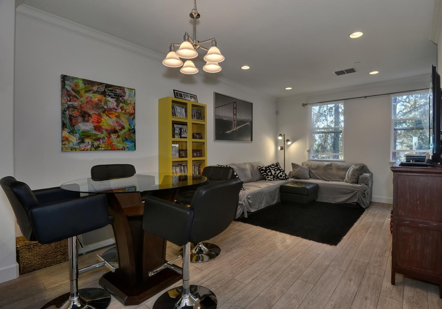 2870 Monroe Terrace San Jose, CA 95128 - Photo 6 of 28 a living room with furniture a chandelier and a flat screen tv