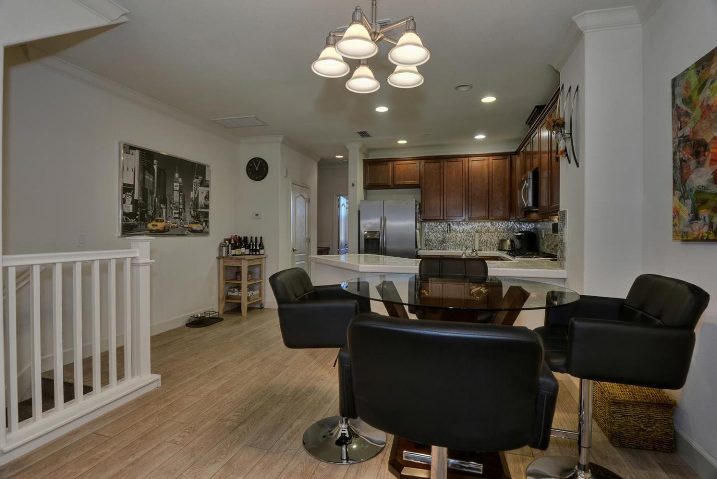 2870 Monroe Terrace San Jose, CA 95128 - Photo 7 of 28 a kitchen with granite countertop a stove and a refrigerator