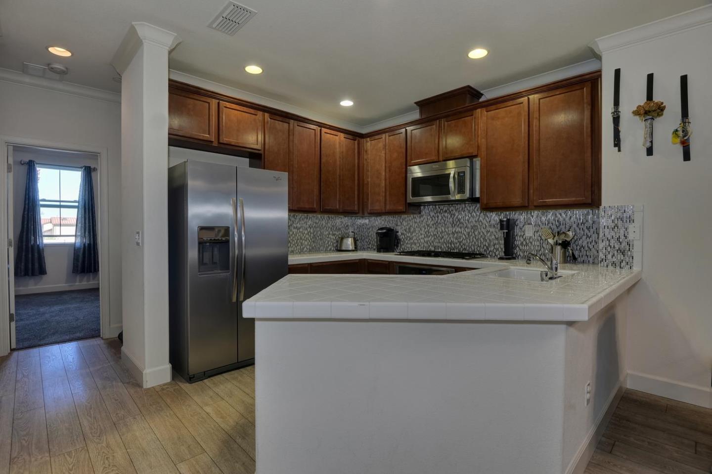 2870 Monroe Terrace San Jose, CA 95128 - Photo 9 of 28 a kitchen with stainless steel appliances granite countertop a sink stove and refrigerator