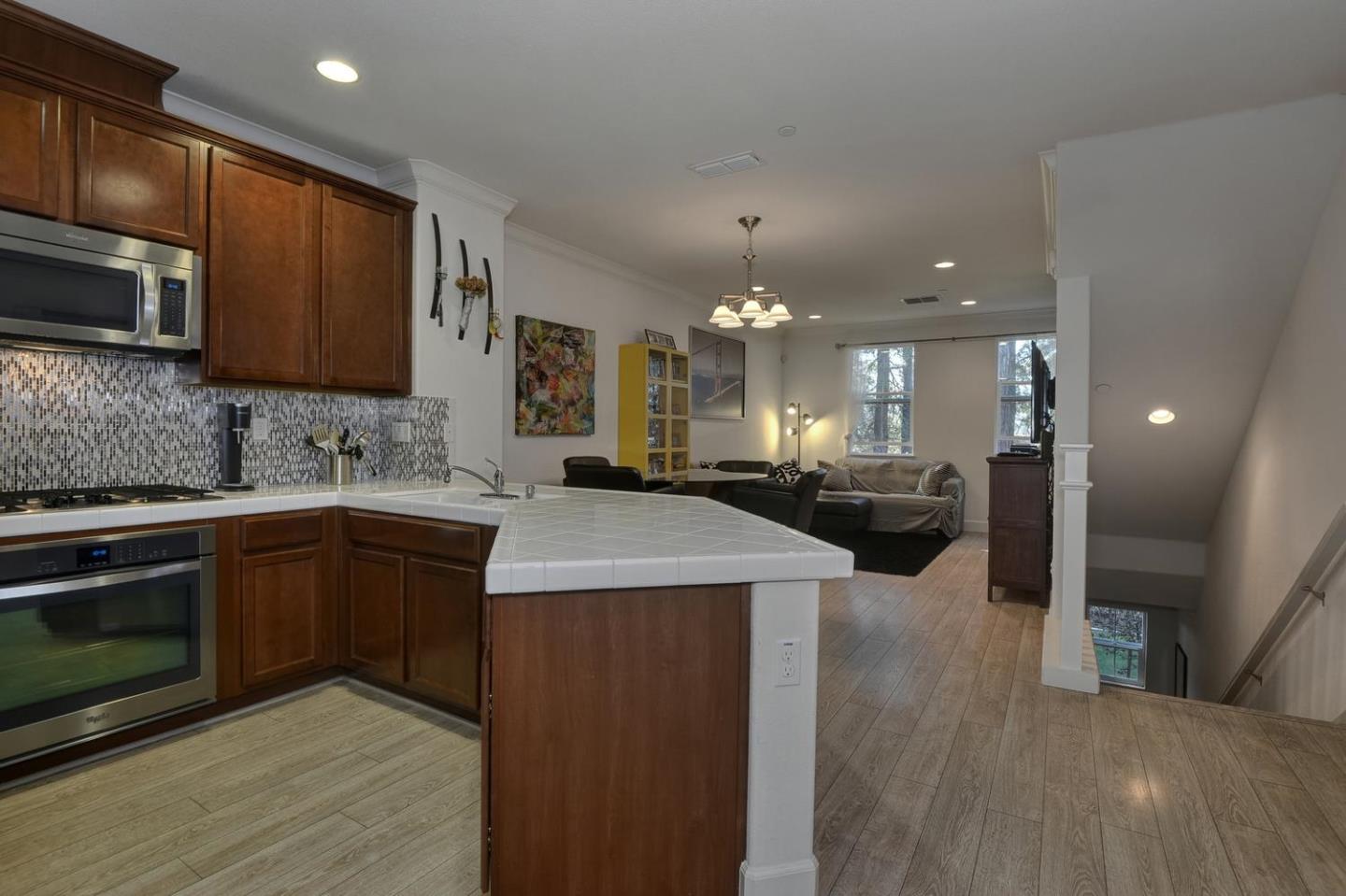 2870 Monroe Terrace San Jose, CA 95128 - Photo 10 of 28 a kitchen with a sink and a microwave oven