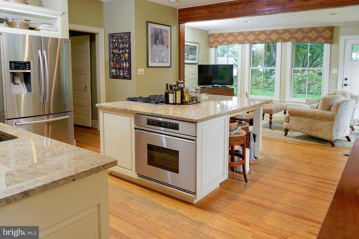 7 Twaddell Mill Road Wilmington, DE 19807 - Photo 13 of 28 Kitchen island opening to sitting room