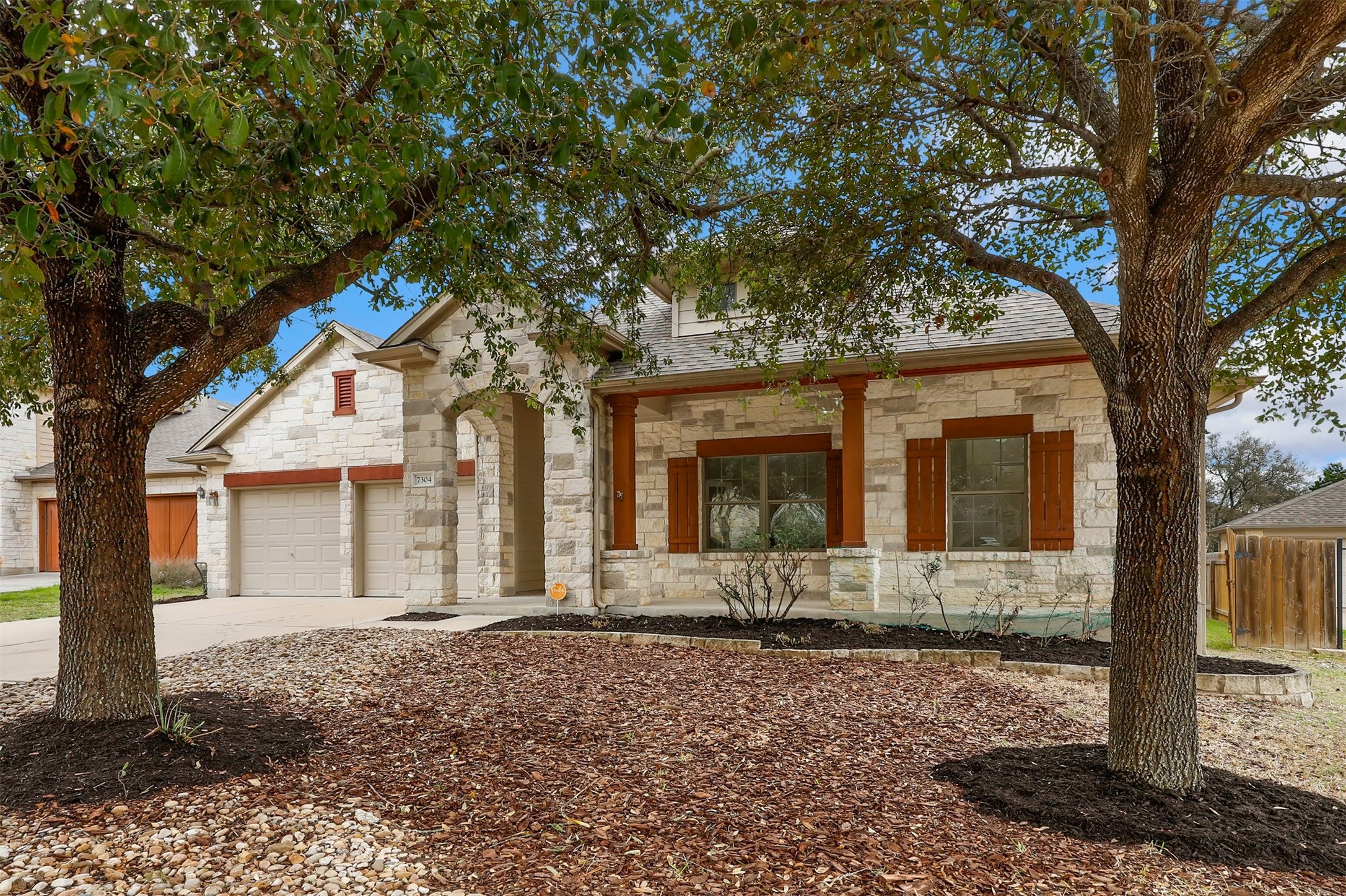7304 Moon Rock Road Austin, TX 78739 - Photo 1 of 1 a front view of a house with a yard