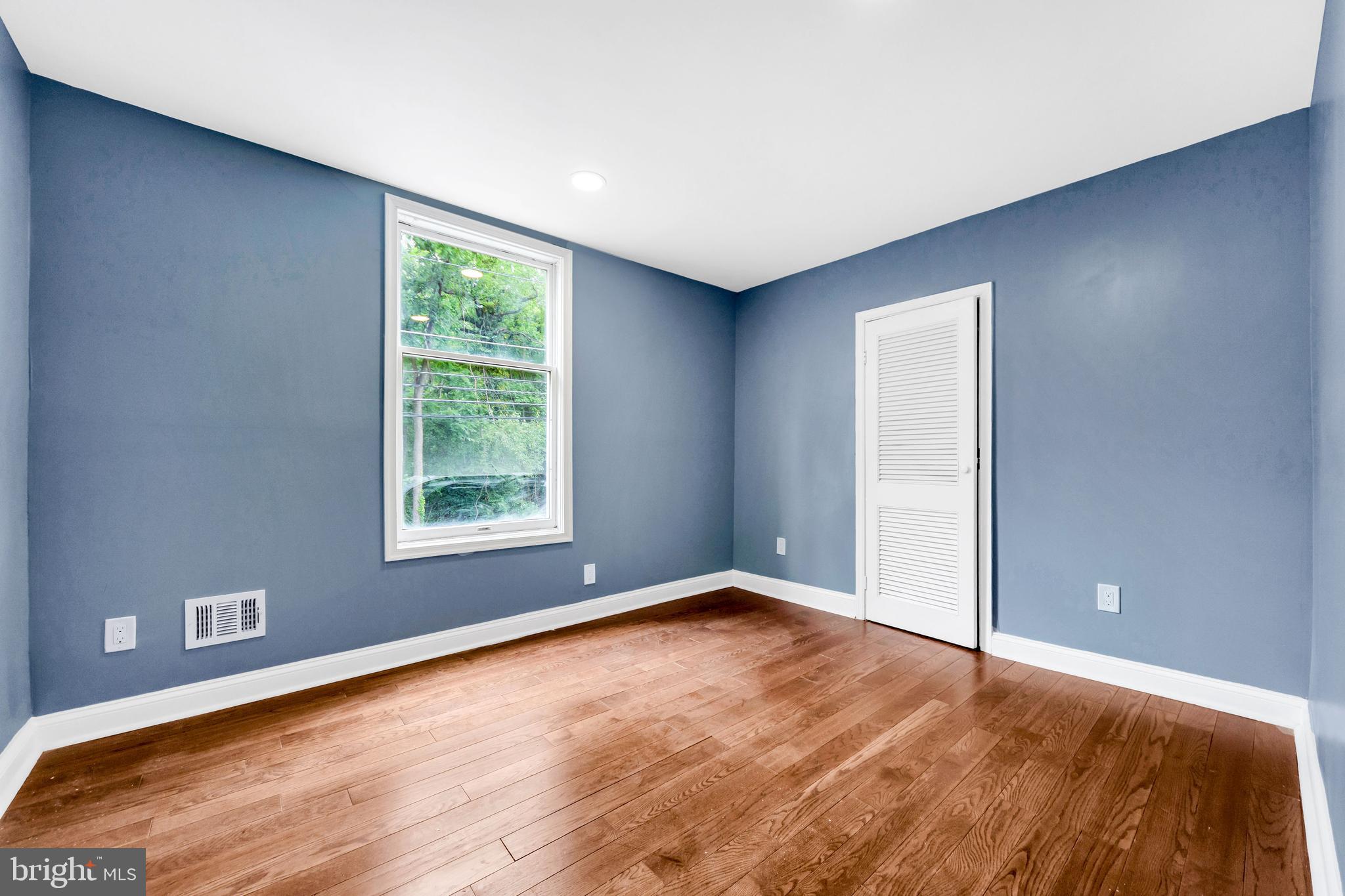 14 West Providence Road Lansdowne, PA 19050 - Photo 10 of 22 a view of an empty room with wooden floor and a window