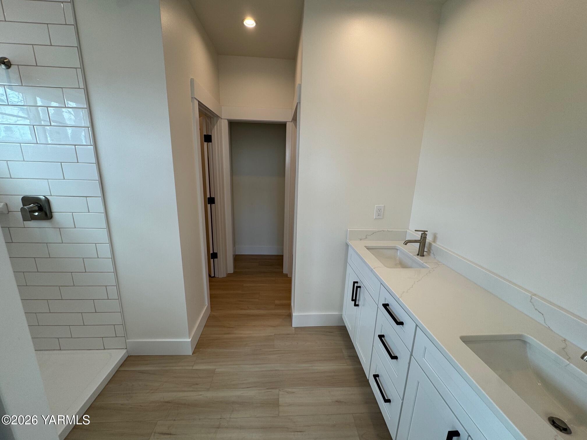 304 6th Street Zillah, WA 98953 - Photo 14 of 29 a bathroom with a double vanity sink and mirror