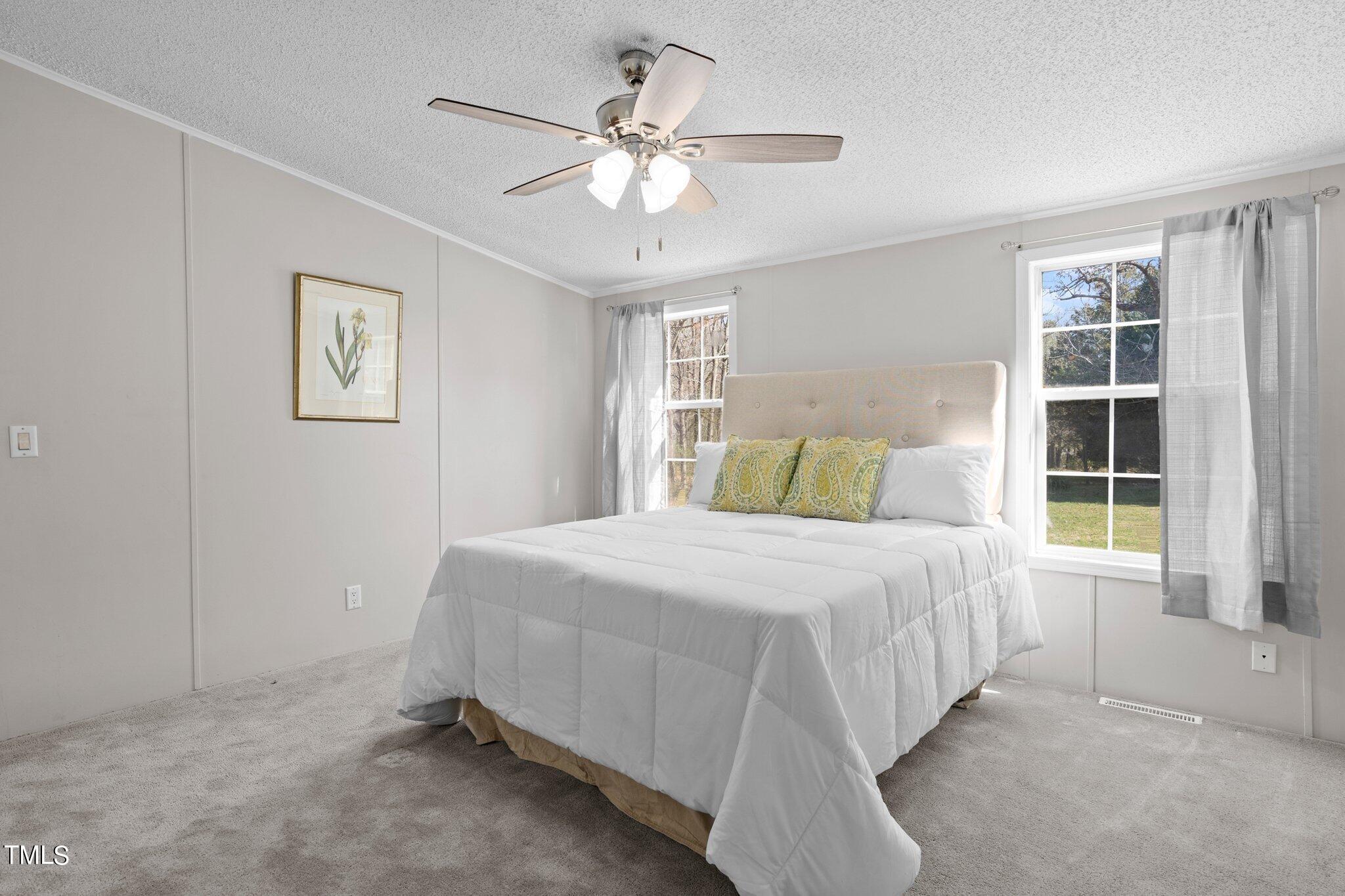 3420 Craven Road Middlesex, NC 27557 - Photo 17 of 31 a bedroom with a bed and window