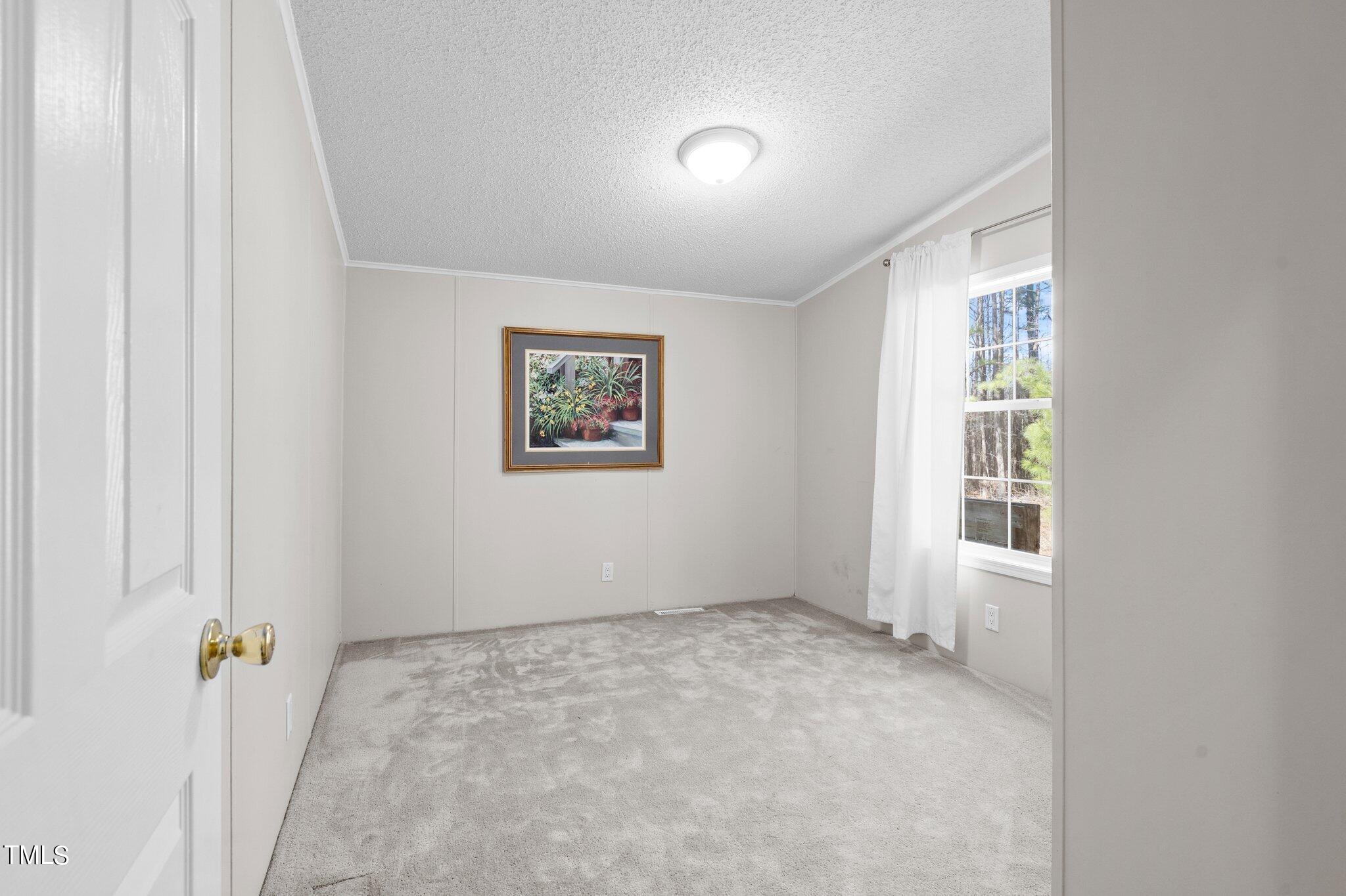 3420 Craven Road Middlesex, NC 27557 - Photo 25 of 31 an empty room with windows