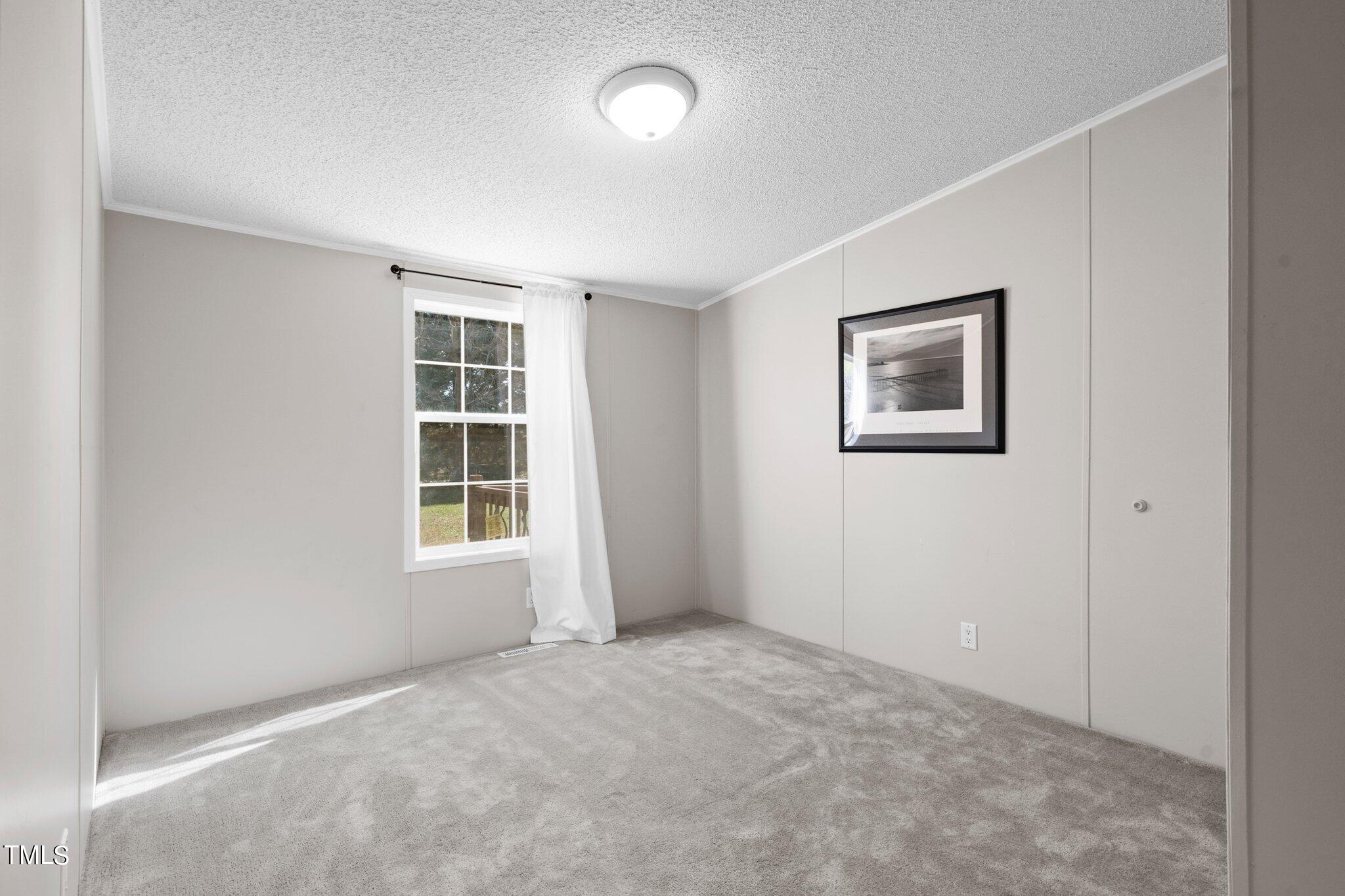3420 Craven Road Middlesex, NC 27557 - Photo 26 of 31 an empty room with windows and closet