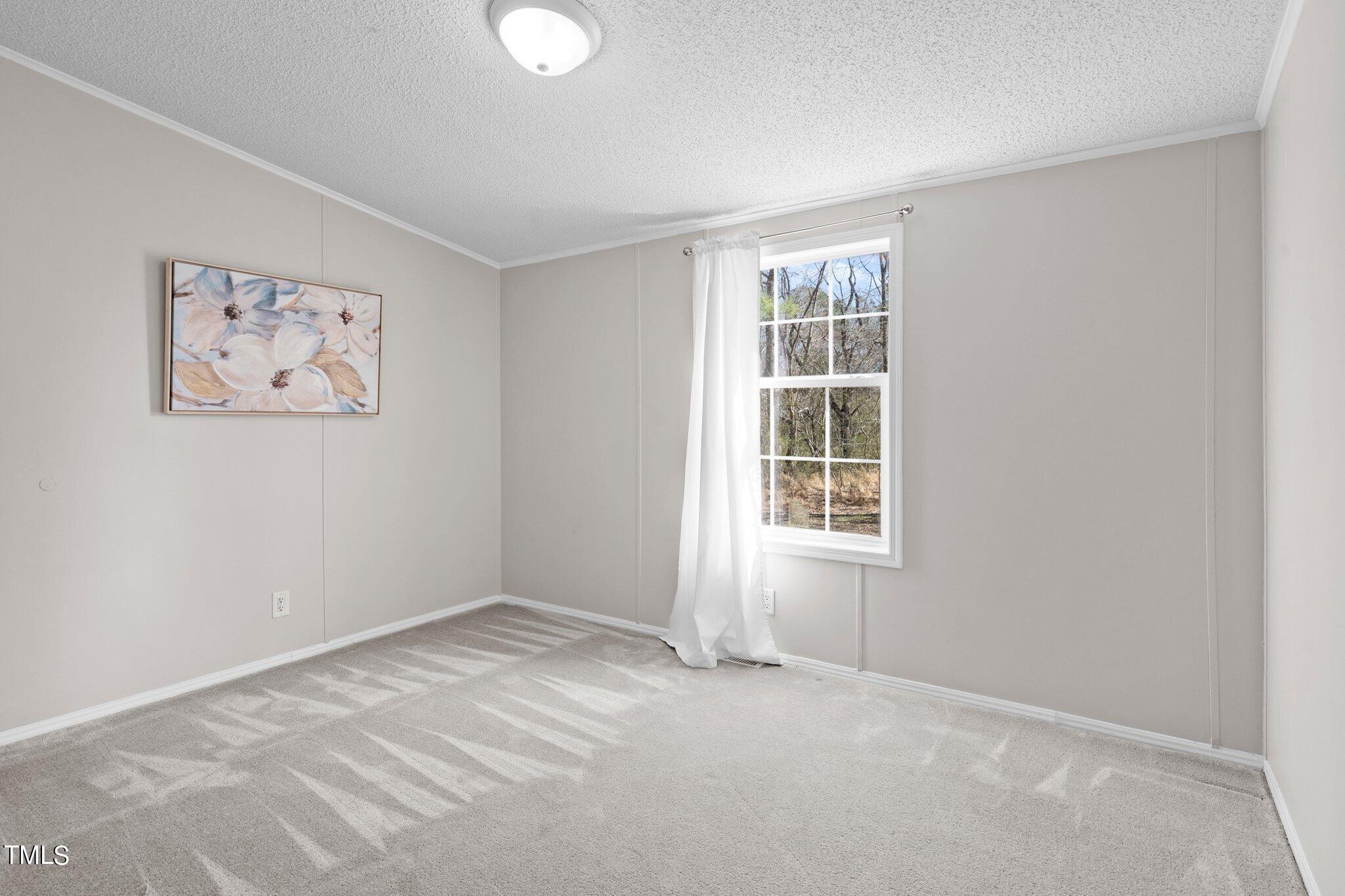 3420 Craven Road Middlesex, NC 27557 - Photo 28 of 31 an empty room with windows