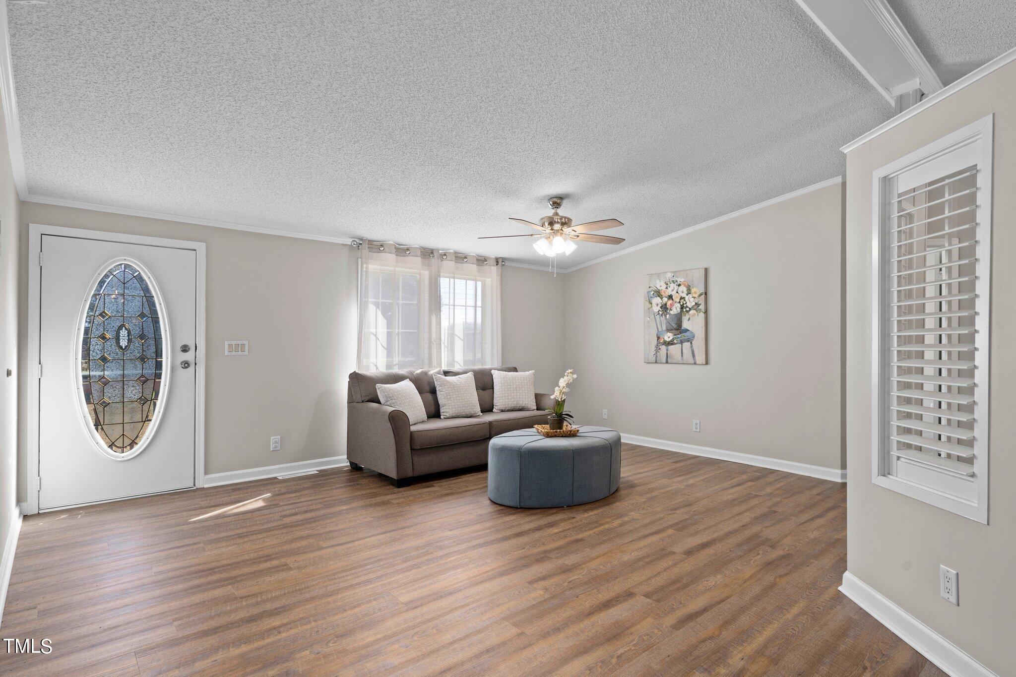 3420 Craven Road Middlesex, NC 27557 - Photo 4 of 31 a living room with furniture and a wooden floor