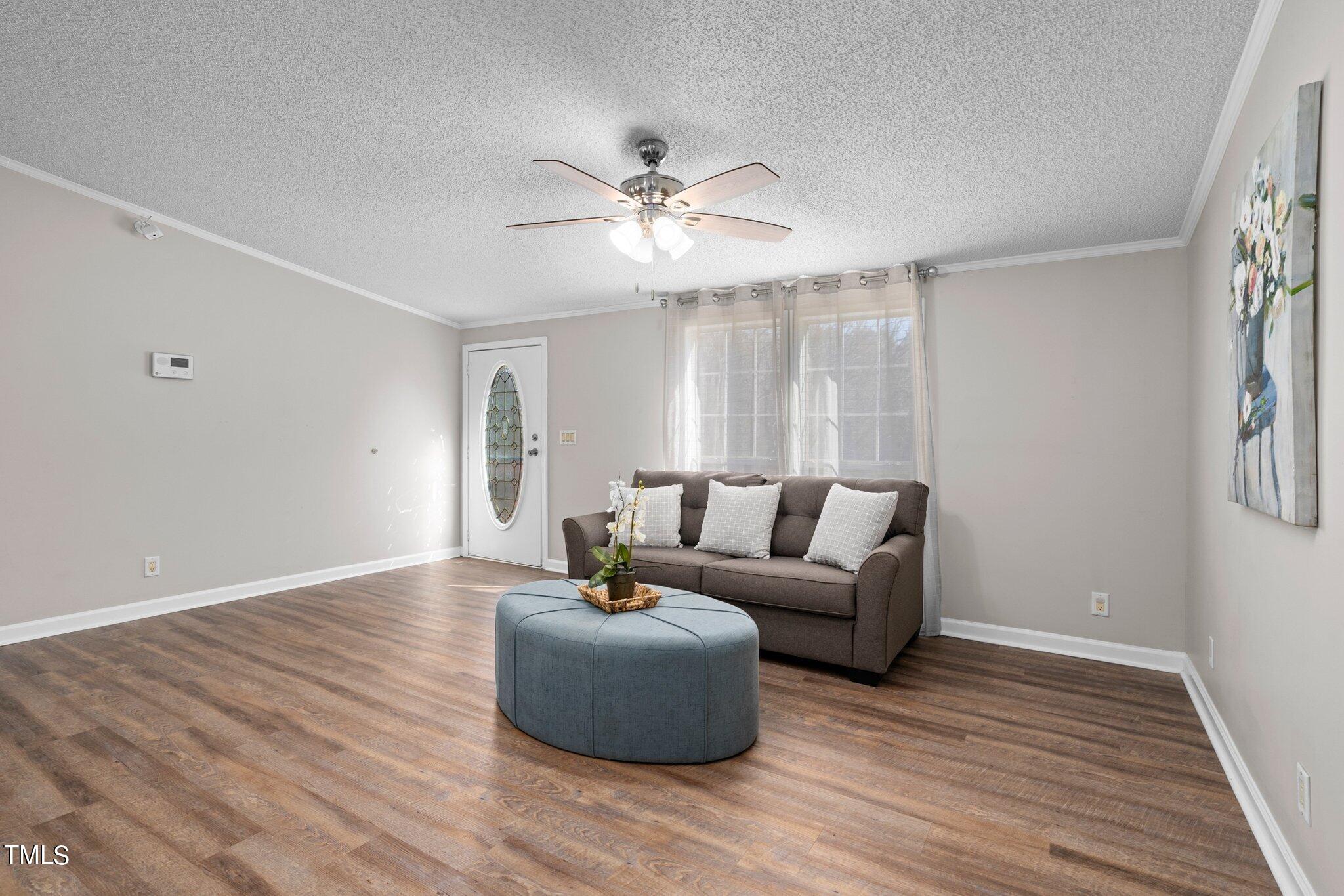 3420 Craven Road Middlesex, NC 27557 - Photo 5 of 31 a living room with furniture and a wooden floor