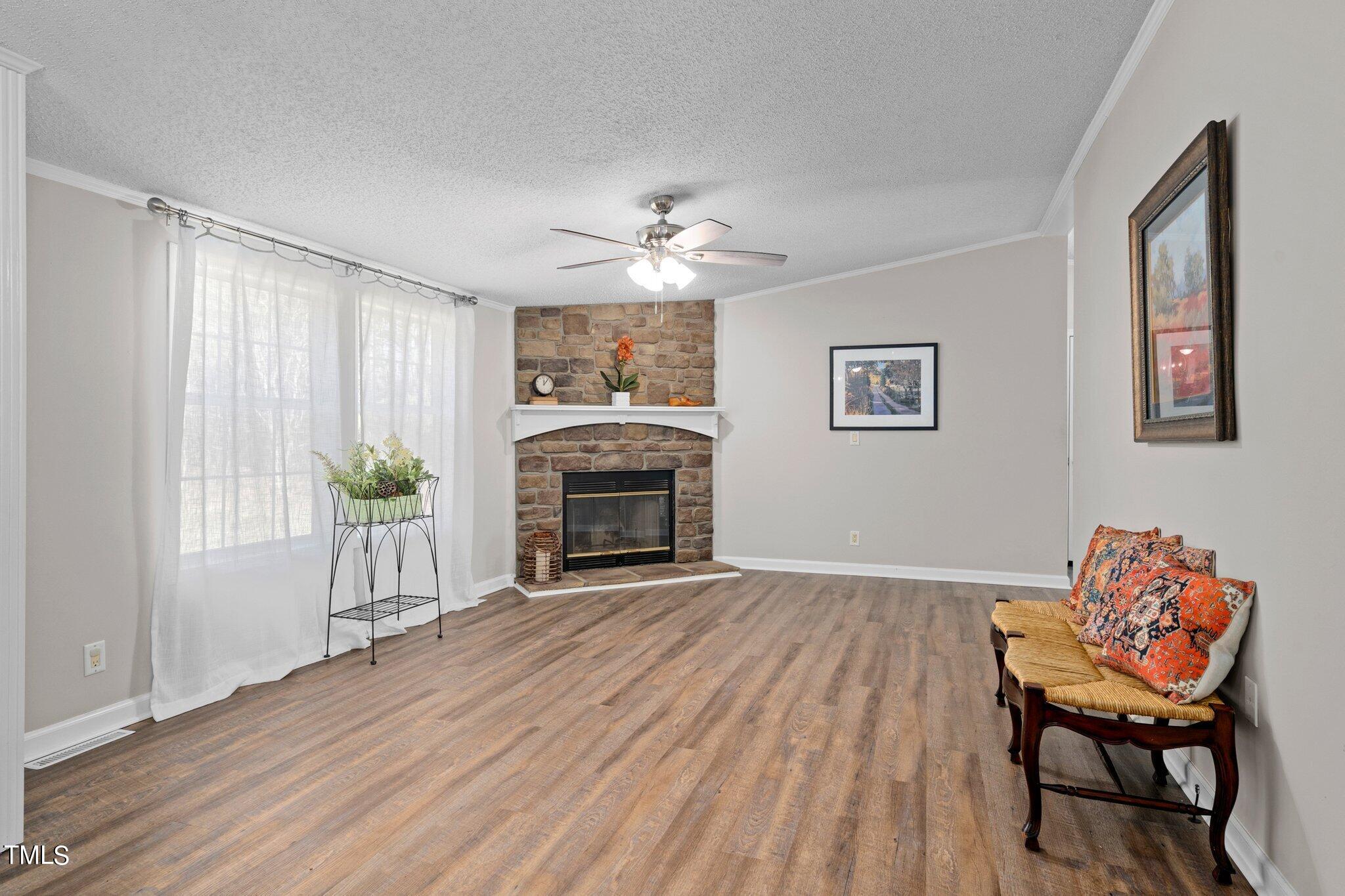 3420 Craven Road Middlesex, NC 27557 - Photo 7 of 31 a view of a livingroom with furniture and a fireplace