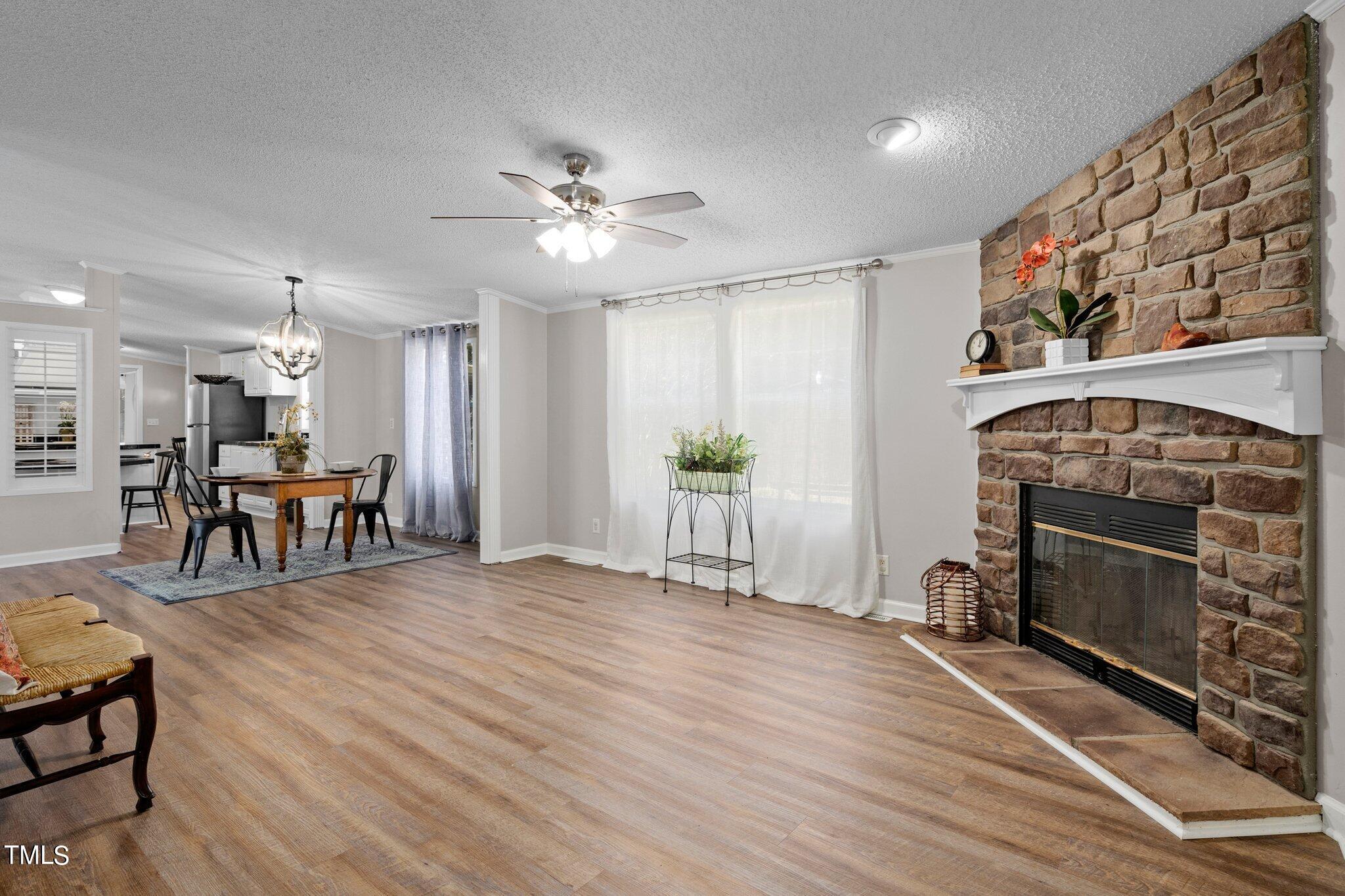 3420 Craven Road Middlesex, NC 27557 - Photo 8 of 31 a view of an empty room with furniture and a fireplace
