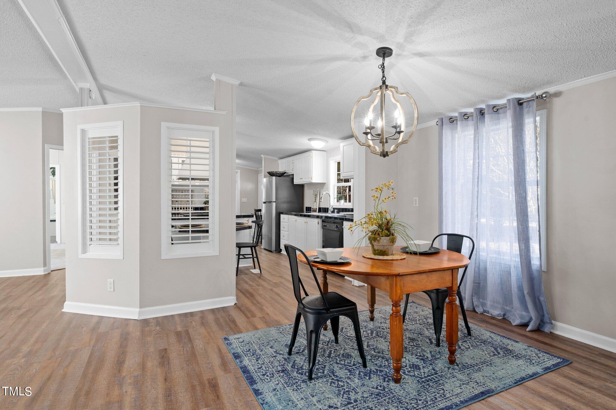 3420 Craven Road Middlesex, NC 27557 - Photo 9 of 31 a view of a dining room with furniture window and wooden floor